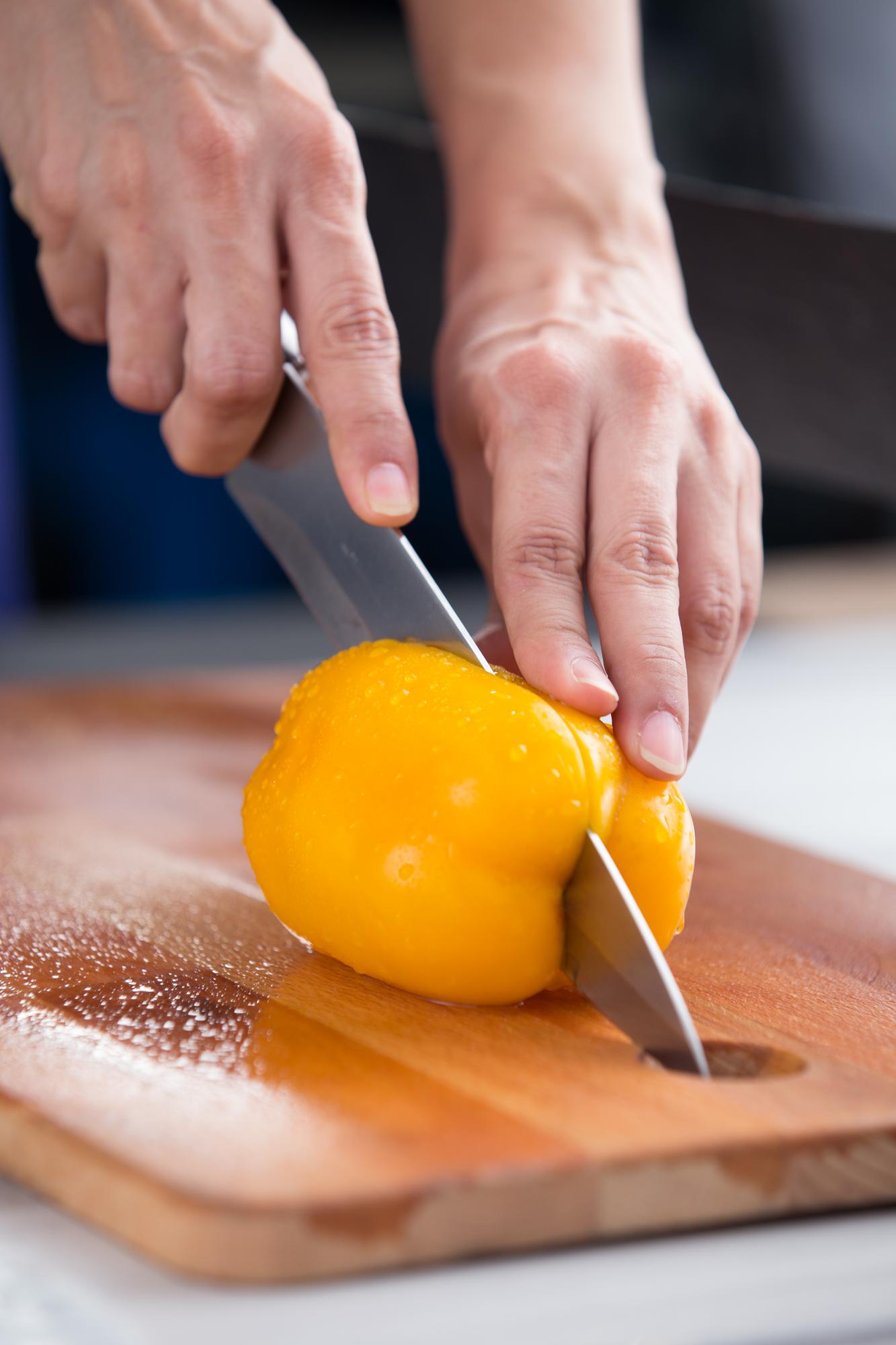 Chef hands slicing citrus for dessert